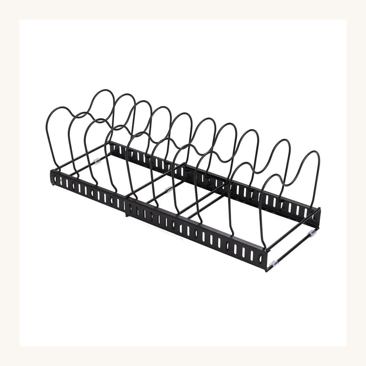 Expandable pan lid organiser creating vertical storage inside a small student kitchen cupboard